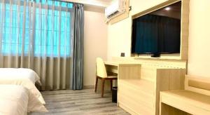 Photo de la galerie de l'établissement JTOUR Inn Maoming Huazhou Beijing Road Railway Station, à Maoming