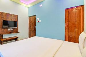 TV a/nebo společenská místnost v ubytování Super Hotel O The Orchid Residency