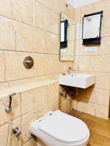 a bathroom with a toilet and a sink at 6Floor in society Ecity ph2 Near TCS Tech Mahindra in Bengaluru