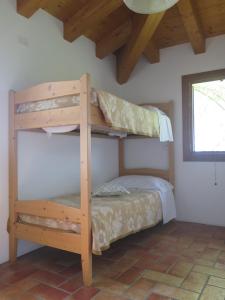 a bedroom with two bunk beds in a room at Tenuta Lio Maggiore in Lido di Jesolo