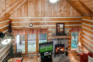 an overhead view of a living room in a log cabin at Mountain Hideaway in Pigeon Forge +13 photos