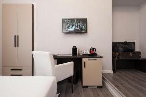 TV a/nebo společenská místnost v ubytování Arenula Suites