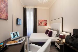TV a/nebo společenská místnost v ubytování Arenula Suites