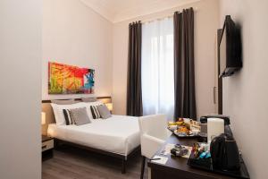 Postel nebo postele na pokoji v ubytování Arenula Suites