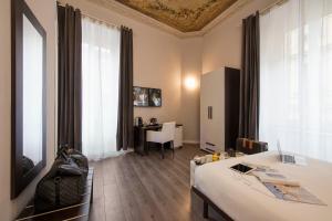 TV a/nebo společenská místnost v ubytování Arenula Suites