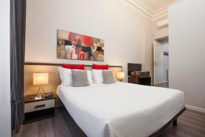 Postel nebo postele na pokoji v ubytování Arenula Suites