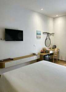 TV a/nebo společenská místnost v ubytování Triland Hotel + 37 fotografií