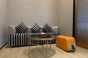 Et sittehjørne på Arthur Hotel Liwan COCO Park Dongsha Metro Guangzhou-24H Coffee & Low Tea & Free Shuttle Bus For Canton Fair By Paco