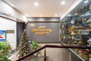 a christmas tree in front of a store at Diamond Luxury Ben Thanh in Ho Chi Minh City