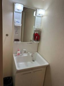 a bathroom with a sink and a mirror at Yuririan in Kyoto +25 photos