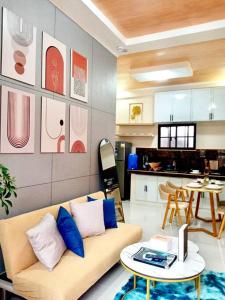 a living room with a couch and a table at FYLL Homes Francheska Suite Calvario St Cavinti Town Proper in Cavinti