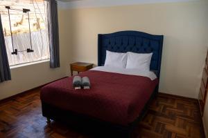 Postel nebo postele na pokoji v ubytování Conquistador Hotel