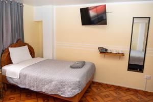 Postel nebo postele na pokoji v ubytování Conquistador Hotel