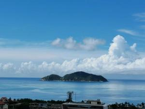 a view of an island in the ocean at Hainan Peninsula Sunshine Seaview Apartment Shenzhou Peninsula Branch in Wanning