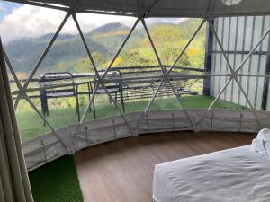 a room with a bed and a large window at The will glamping&camping in Ban Na Pho +19 photos