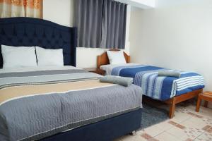 Postel nebo postele na pokoji v ubytování Conquistador Hotel