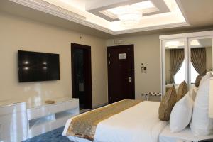 Voodi või voodid majutusasutuse Remaj Hotel toas