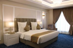 Voodi või voodid majutusasutuse Remaj Hotel toas