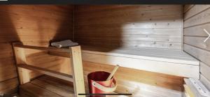 a sauna with a bench in a wooden room at Paukavuori in Seinäjoki