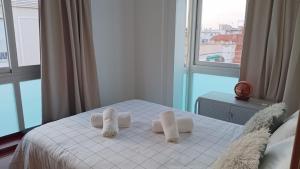 Кровать или кровати в номере Centro Linares Santiago PONDOS