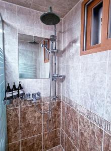 a shower in a tiled bathroom with a shower at Homey 무료주차 넓은숙소 그룹여행 in Seoul +35 photos