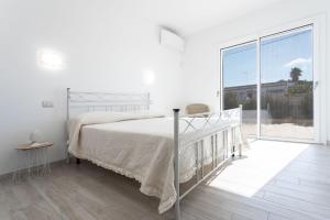 Кровать или кровати в номере villa Alba chiara sul mare