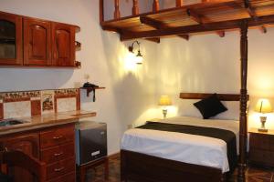 a bedroom with a bed and a sink in it at Epoca Iquitos in Iquitos +37 photos