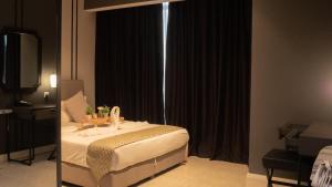 Postel nebo postele na pokoji v ubytování Axon Residence KLCC - LM HOME