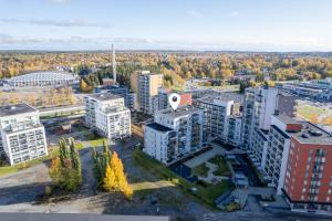 an aerial view of a city with tall buildings at Modern 1BR Apartment in Kaleva next to Tram Line in Tampere +7 photos