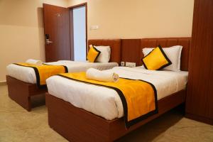 Postel nebo postele na pokoji v ubytování UJ Pallazzio - Business Class Luxury Hotel