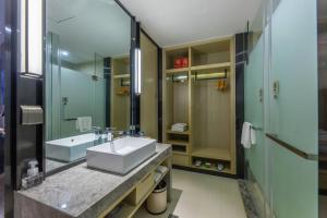 Koupelna v ubytování Echarm Hotel Wuhan Hanyang Wangjiawan Sixin Avenue Metro Station + 9 fotografií