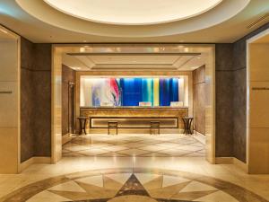 a lobby with a rainbow projected on the wall at Princess Garden Hotel in Nagoya