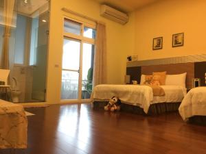 Postel nebo postele na pokoji v ubytování Jing Xiang Hua Nong B&B