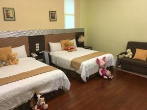 Postel nebo postele na pokoji v ubytování Jing Xiang Hua Nong B&B