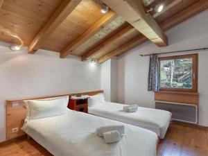 Ένα ή περισσότερα κρεβάτια σε δωμάτιο στο Chalet Paradiski, les Arcs Peisey Vallandry 10personnes