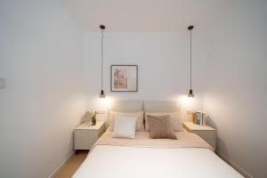 Letto o letti in una camera di John's Apartment