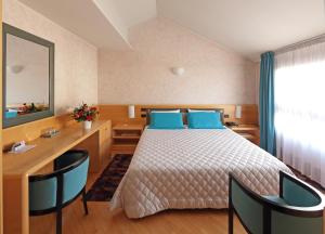 Postel nebo postele na pokoji v ubytování Hotel Contà Taste The Experience + 37 fotografií