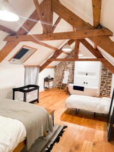 Postel nebo postele na pokoji v ubytování La Maison Gavraise