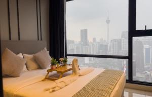 Postel nebo postele na pokoji v ubytování Axon Residence KLCC - LM HOME + 37 fotografií