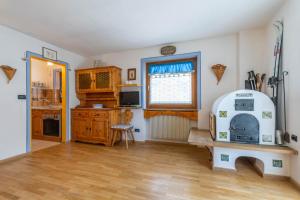 a kitchen with an old fashioned stove in a room at Casa Riccardo in Soraga +14 photos