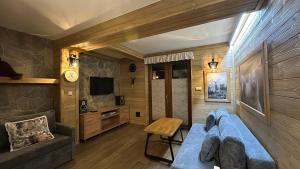 Μια τηλεόραση ή/και κέντρο ψυχαγωγίας στο Apartament Nad Potokiem