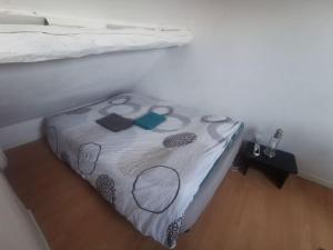 Un ou plusieurs lits dans un hébergement de l'établissement Duplex House Paris-CDG-Astérix