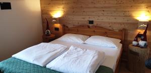 Postel nebo postele na pokoji v ubytování Hotel Lares