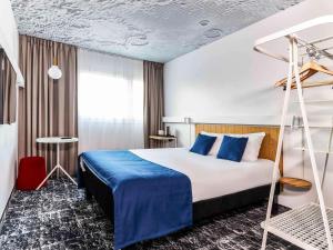 Postel nebo postele na pokoji v ubytování ibis Warszawa Centrum