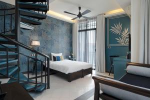 Postel nebo postele na pokoji v ubytování Maison Vy Hotel Hội An