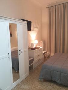 A bed or beds in a room at Affittacamere Euro Még 7 kép