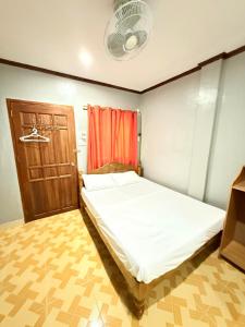 Postel nebo postele na pokoji v ubytování C.A.F. MALAPASCUA DIVA INN + 17 fotografií