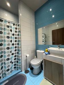 a bathroom with a toilet and a sink and a shower at RIVER CITY Studio in Larisa +30 photos