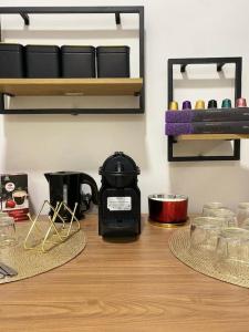 a coffee maker sitting on a wooden table in a room at Beautiful Rooms Nº4 in Camas +8 photos
