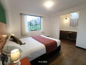 Letto o letti in una camera di Hotel and Country House Valle Sagrado de los Incas